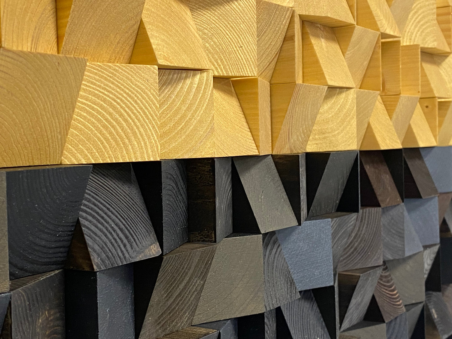 Modern sound diffuser wall panel featuring golden accents for high-end interior design.