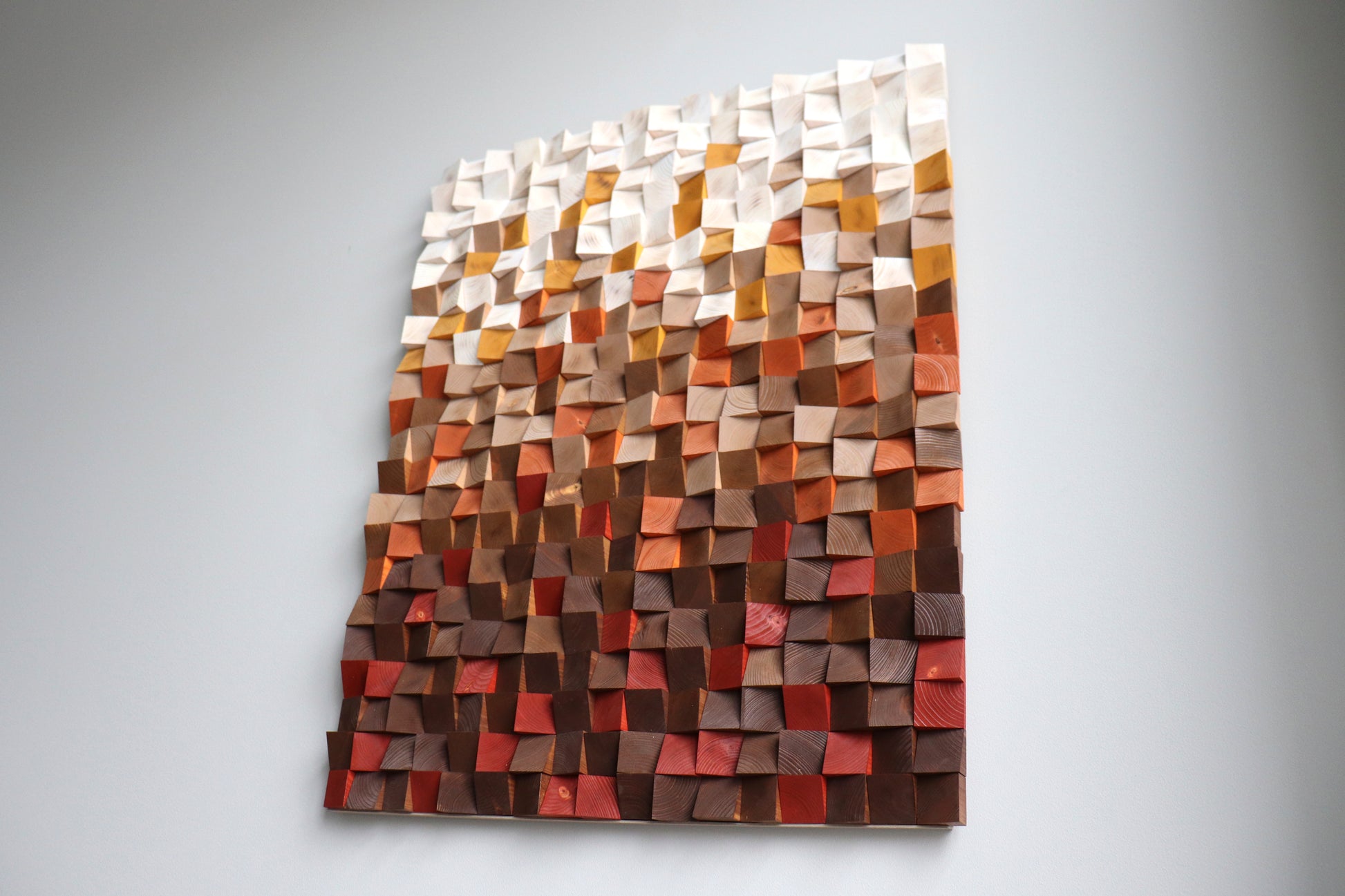 Wide front lifestyle shot of handcrafted wooden wall art; modern decor handmade in Europe.