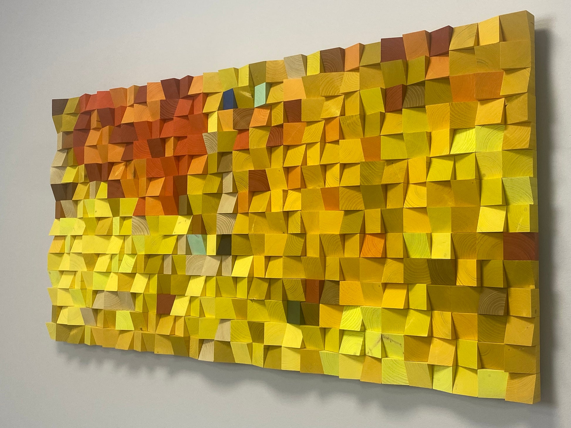 Modern acoustic wall panel by WoodenPix combining natural textures and vibrant fall colors.