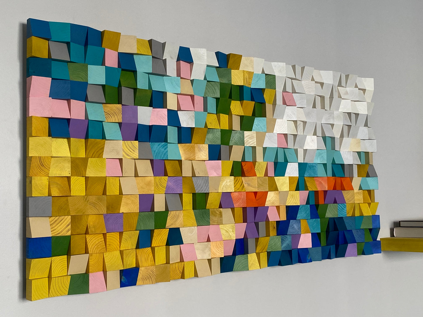 Rainbow-toned wooden mosaic artwork with layered 3D texture.