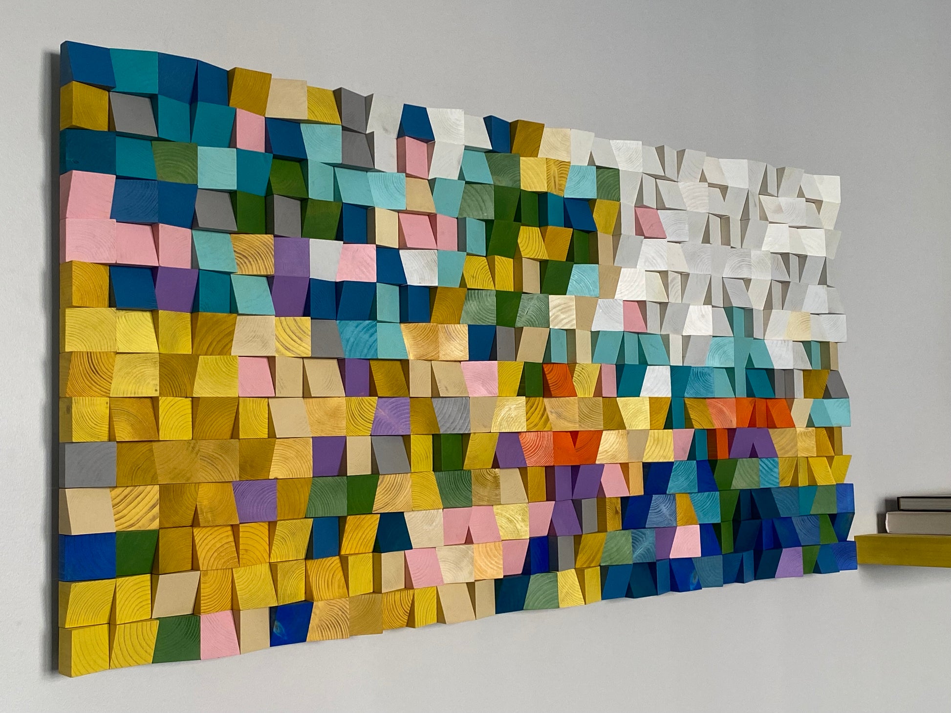 Rainbow-toned wooden mosaic artwork with layered 3D texture.