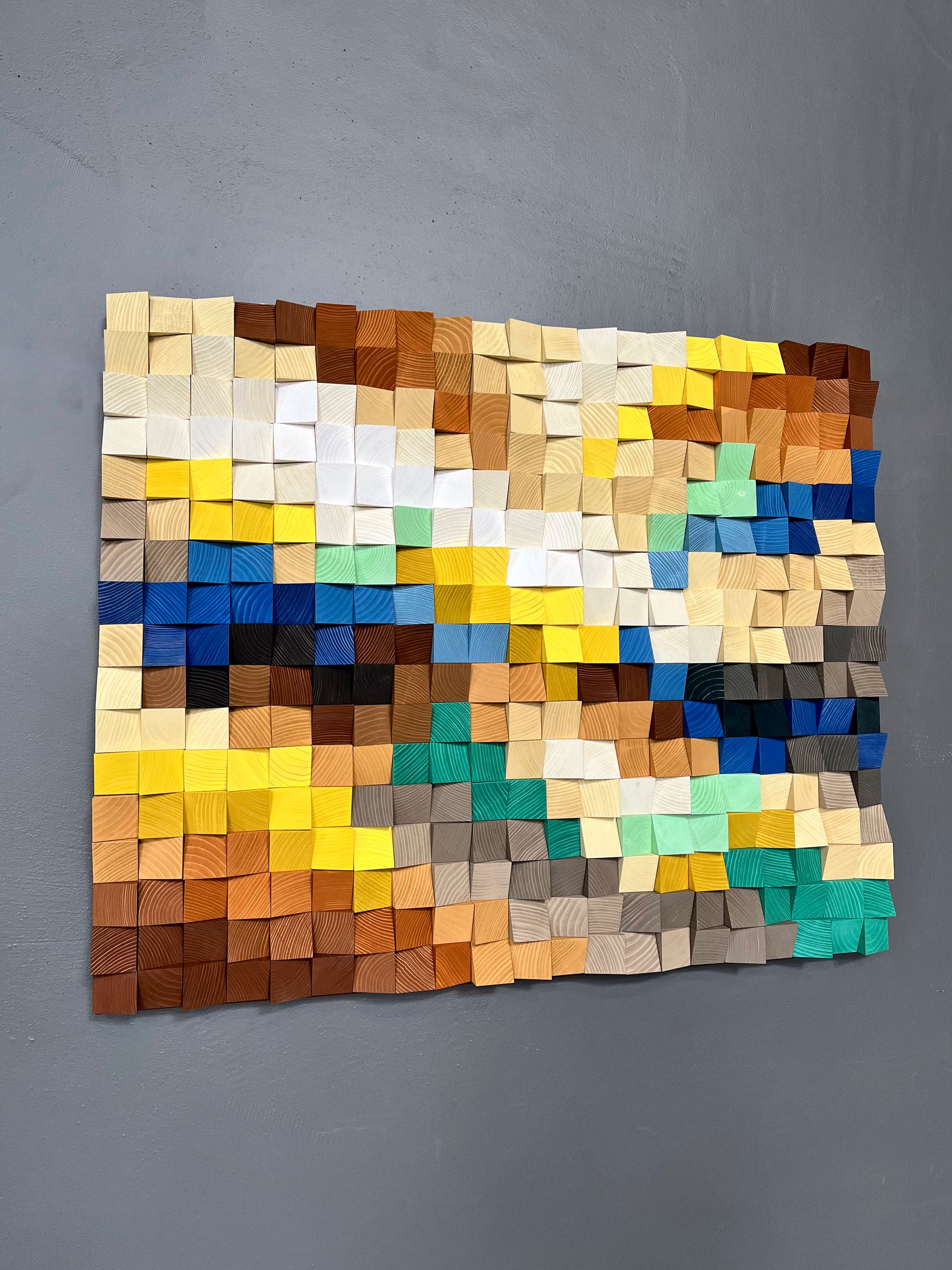 Decorative wall art made of hand-painted wood blocks for depth, warmth, and sound harmony.