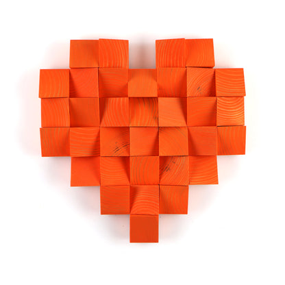 Handmade orange heart wall art crafted from solid wooden blocks in a bold pixel-style 3D design
