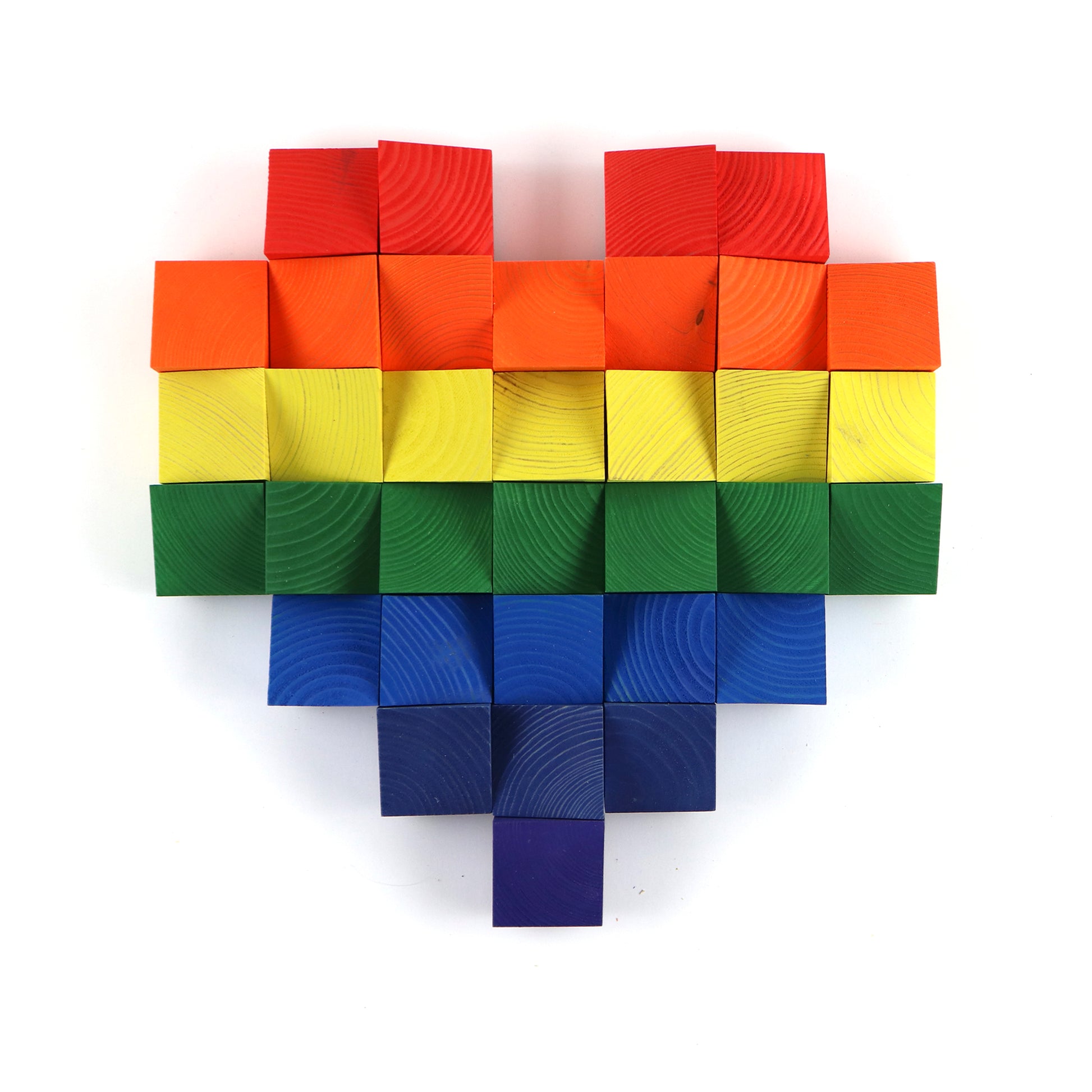Rainbow pixel heart wall art made from layered wooden cubes arranged in a modern pattern