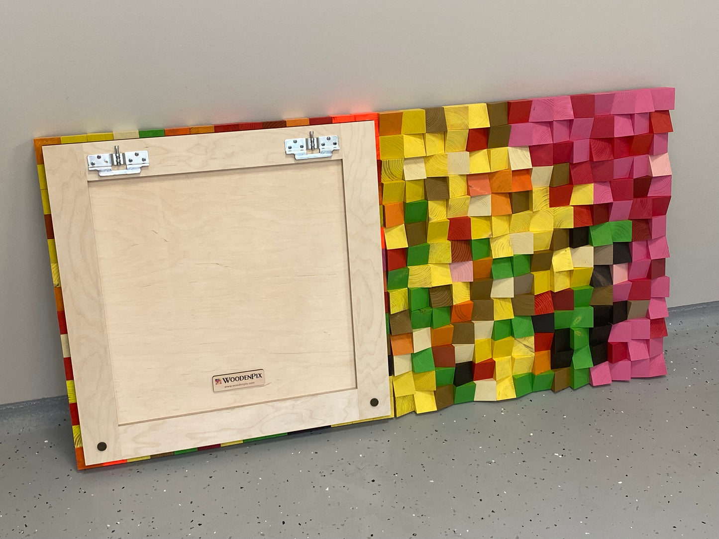 Pixel art-inspired wooden wall art piece with vibrant colors enhancing texture and acoustic performance.