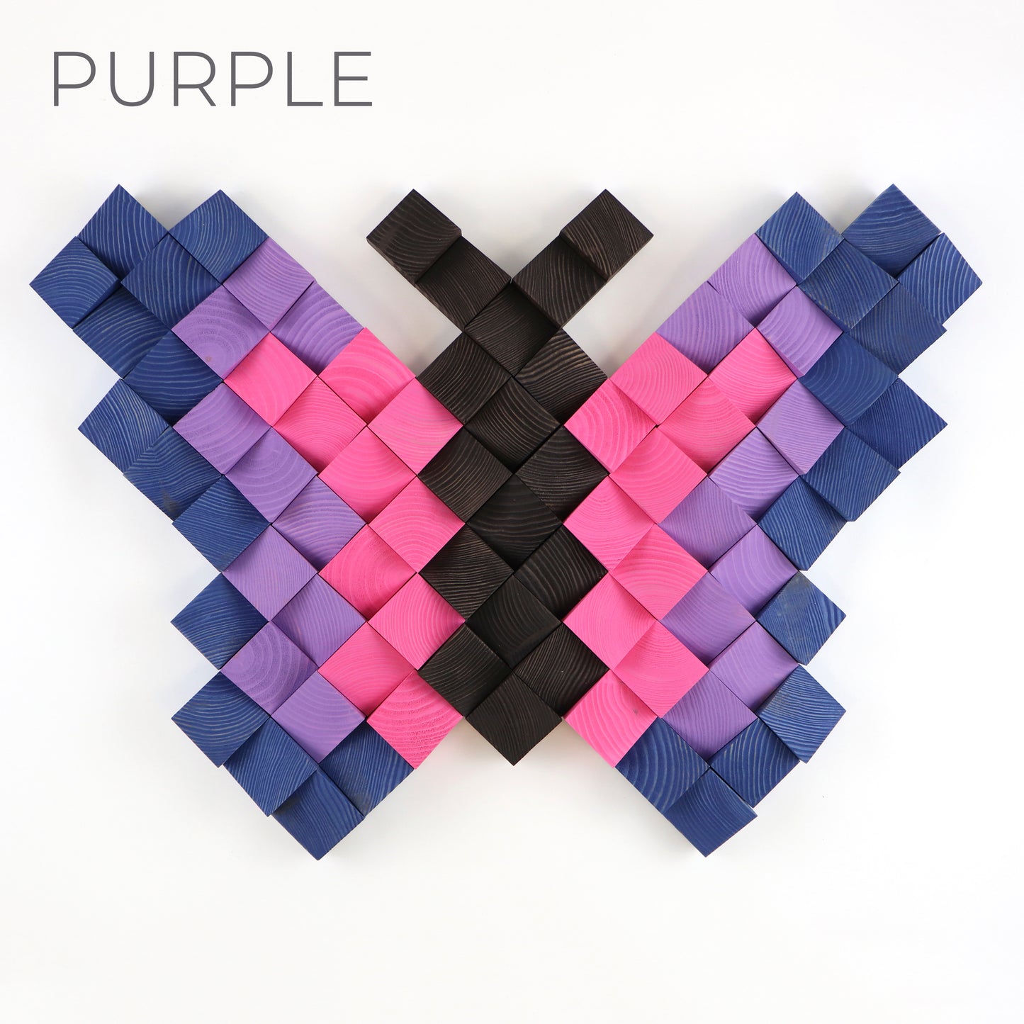 Purple and pink wooden butterfly wall art panel featuring layered geometric wood pieces.