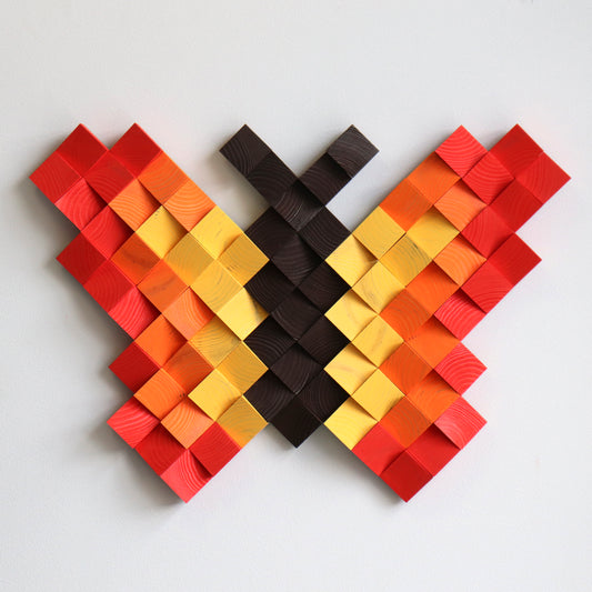 Red and orange wooden butterfly artwork designed with multilevel carved wood blocks.