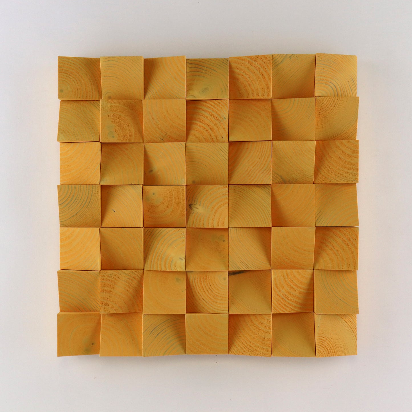 Handcrafted Saffron Yellow 3D wooden wall panel featuring curved carved blocks and a bold warm tone for vibrant modern interior decor.