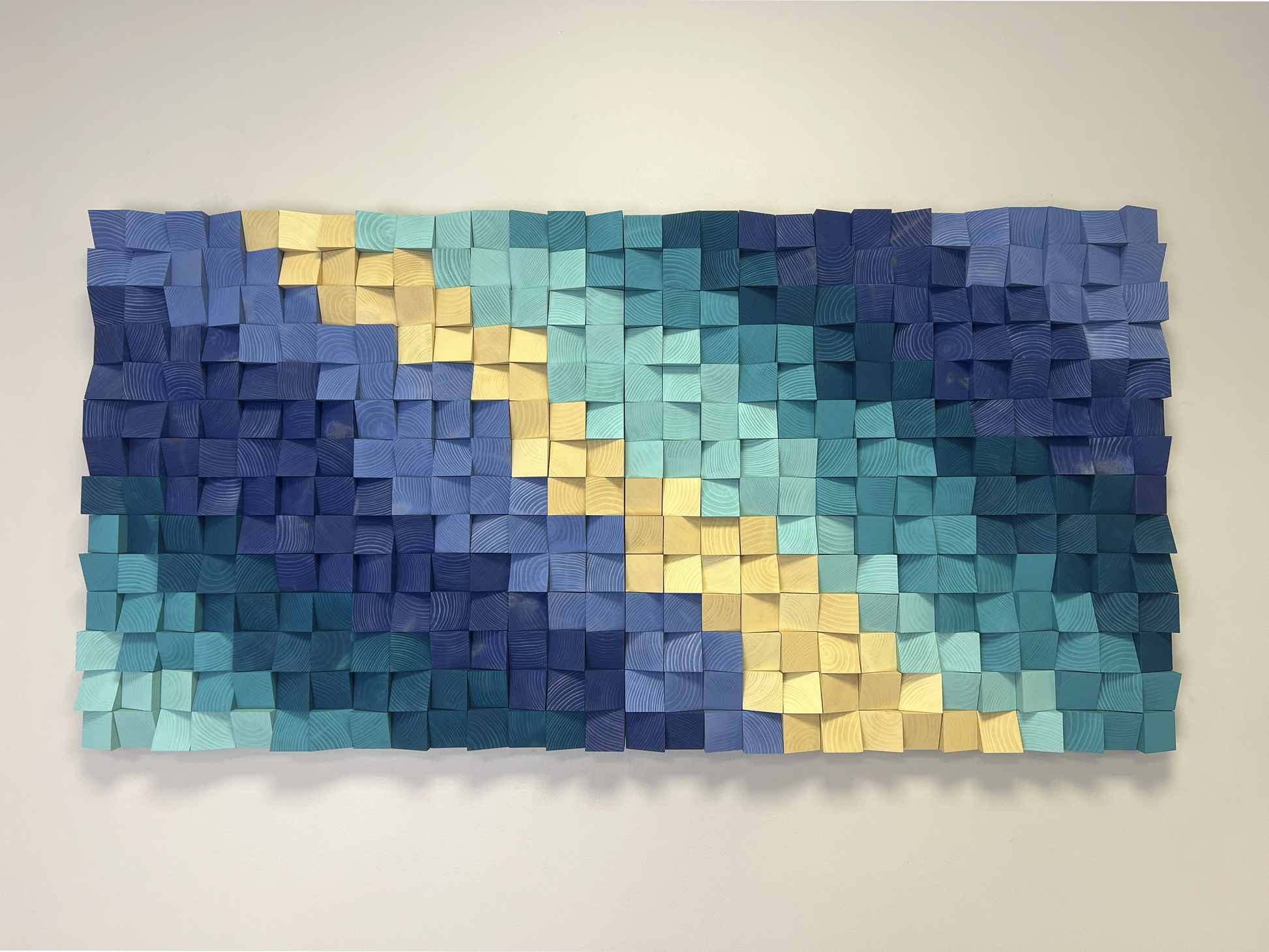 Sandbank handcrafted wooden wall panel reflecting sea tones and artisanal design.