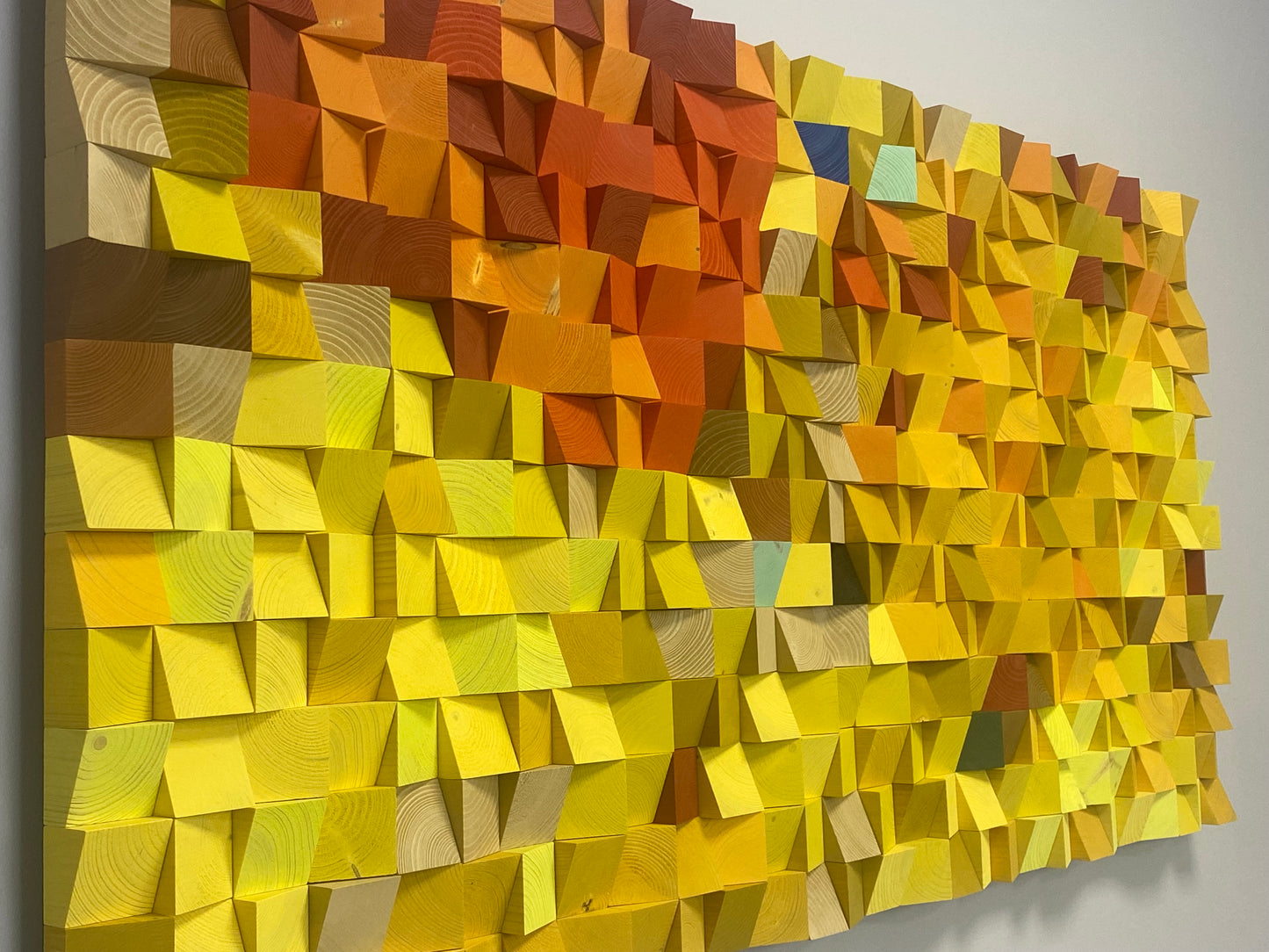 Warm-toned wooden wall decor bringing texture, depth, and acoustic function to interior spaces.