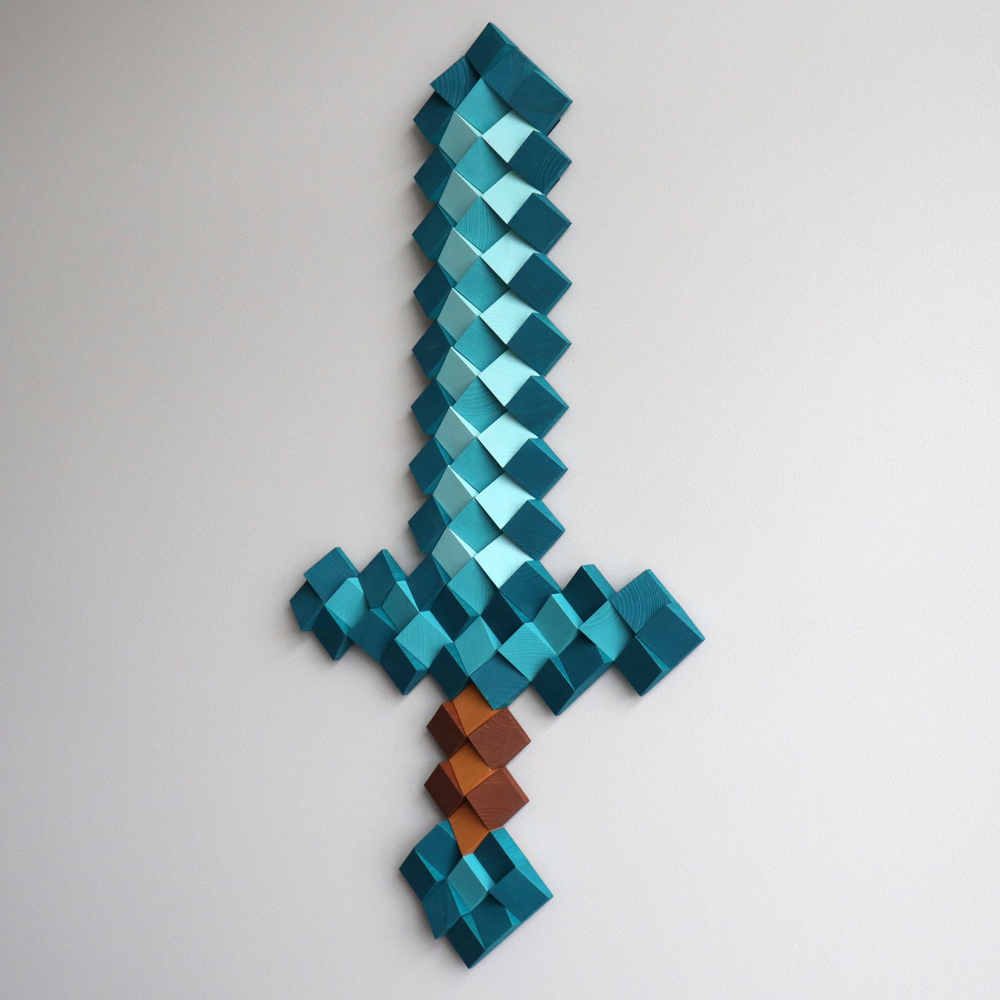 Minecraft diamond sword wall art created from individual geometric wooden cubes
