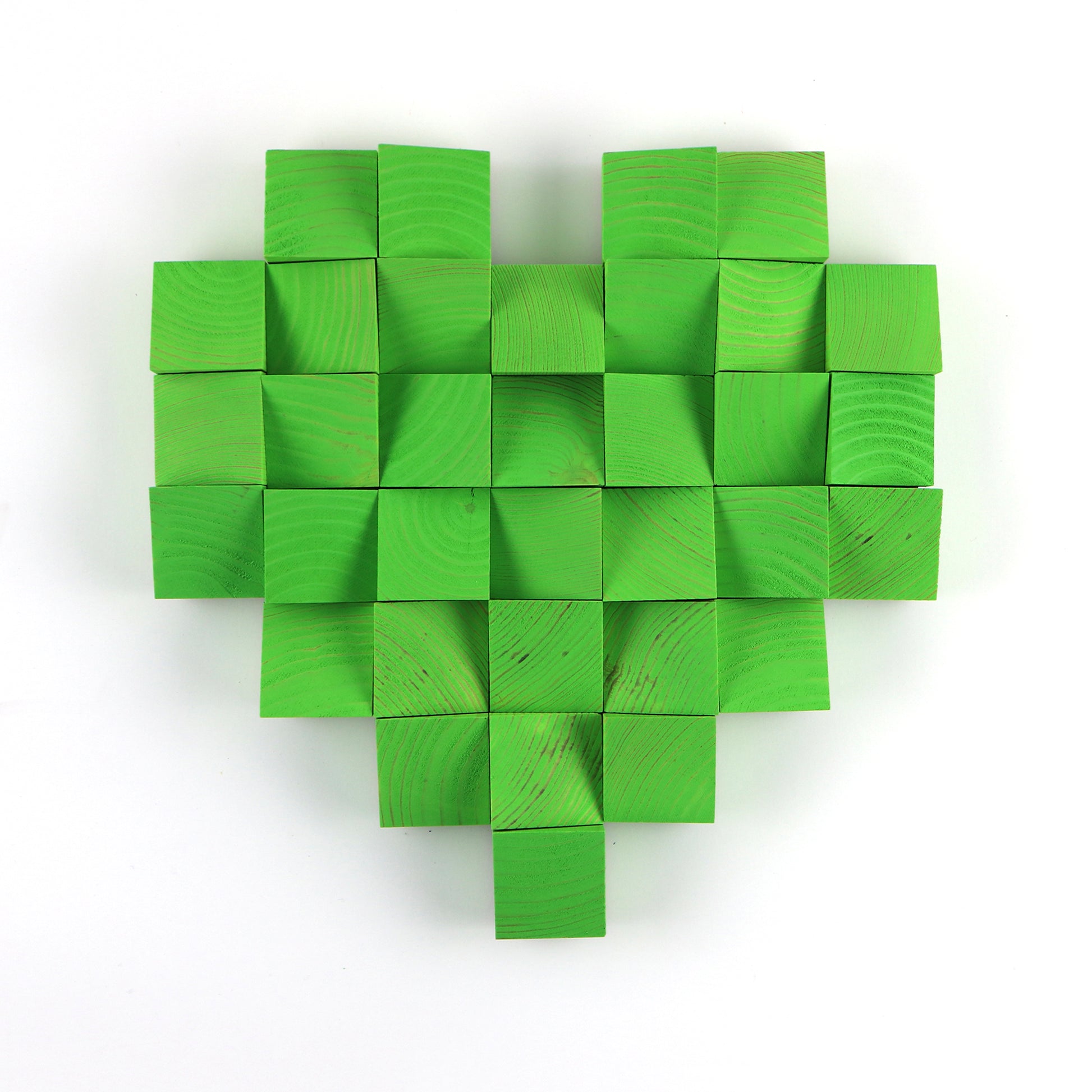 Handmade green heart wall art built from painted wooden blocks in a pixel-inspired layout