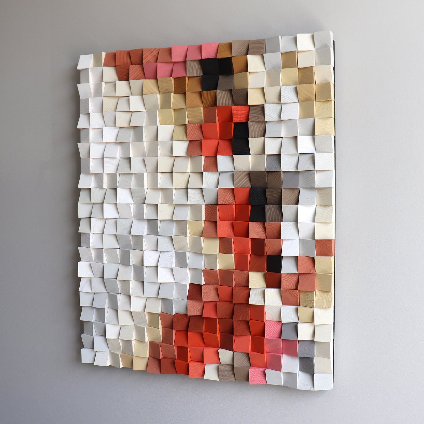 Handcrafted 3D wooden wall art with red and beige geometric blocks