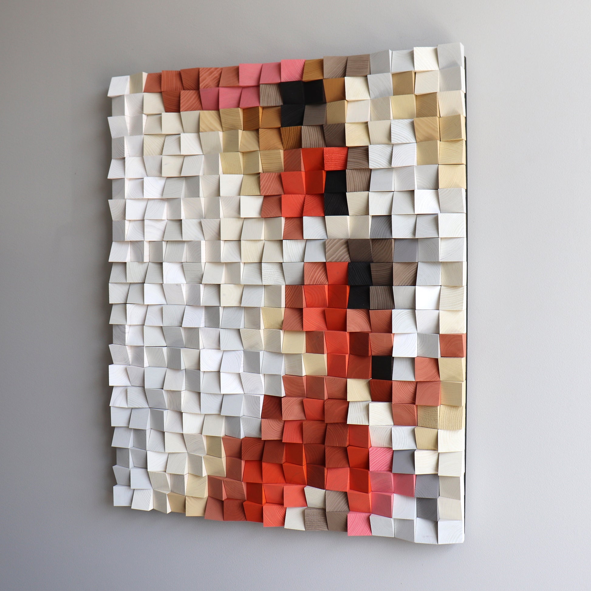 Handcrafted 3D wooden wall art with red and beige geometric blocks