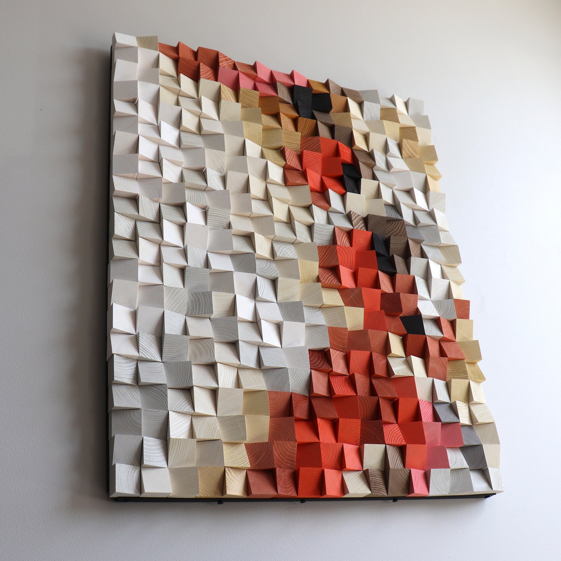 Modern handcrafted wood wall sculpture with depth and color
