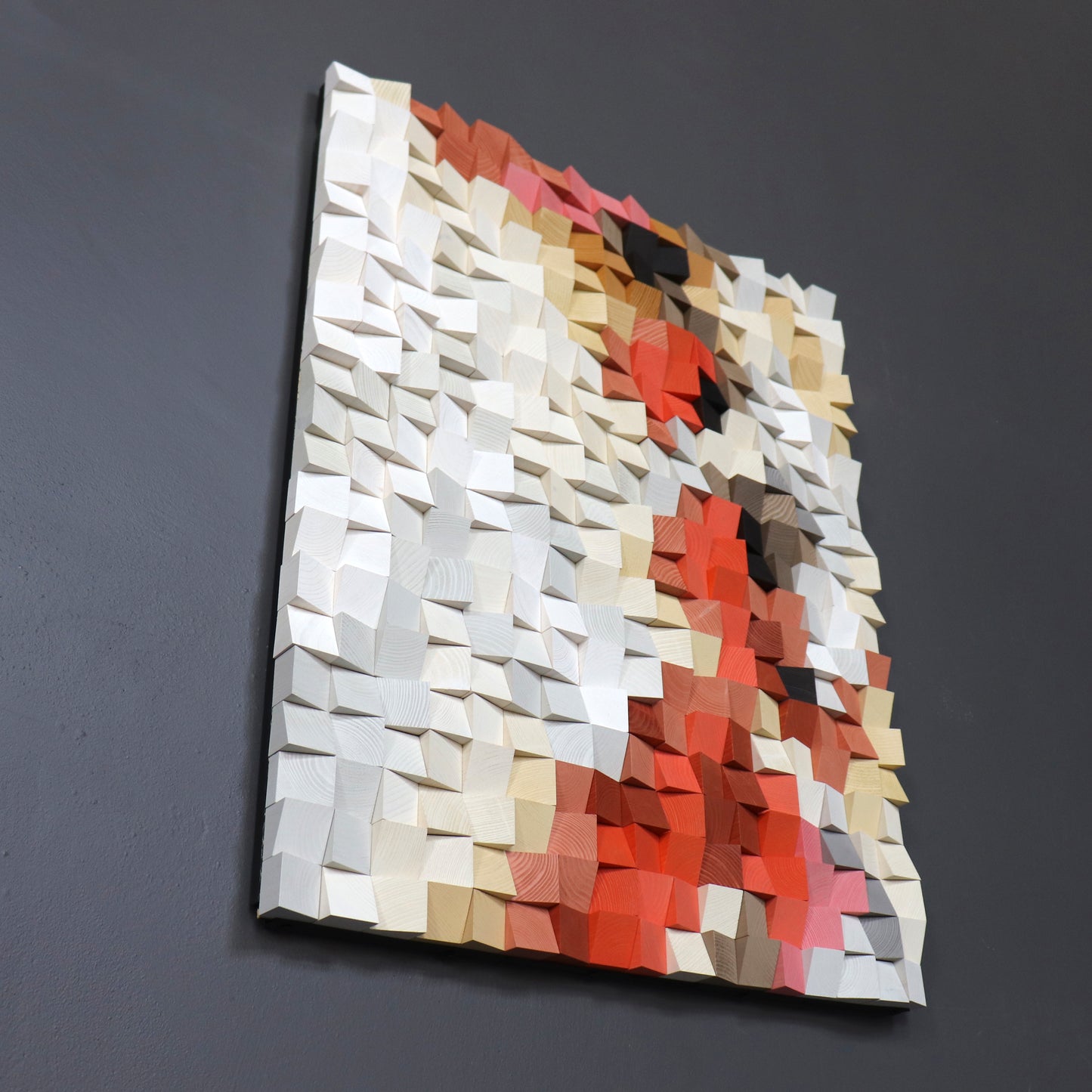 Multicolored geometric wall art on a dark gray background