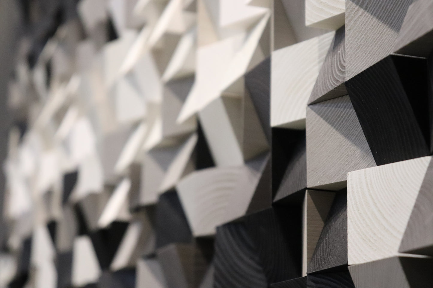 Black, white, and grey wooden wall art piece offering a bold, contemporary look for modern spaces.