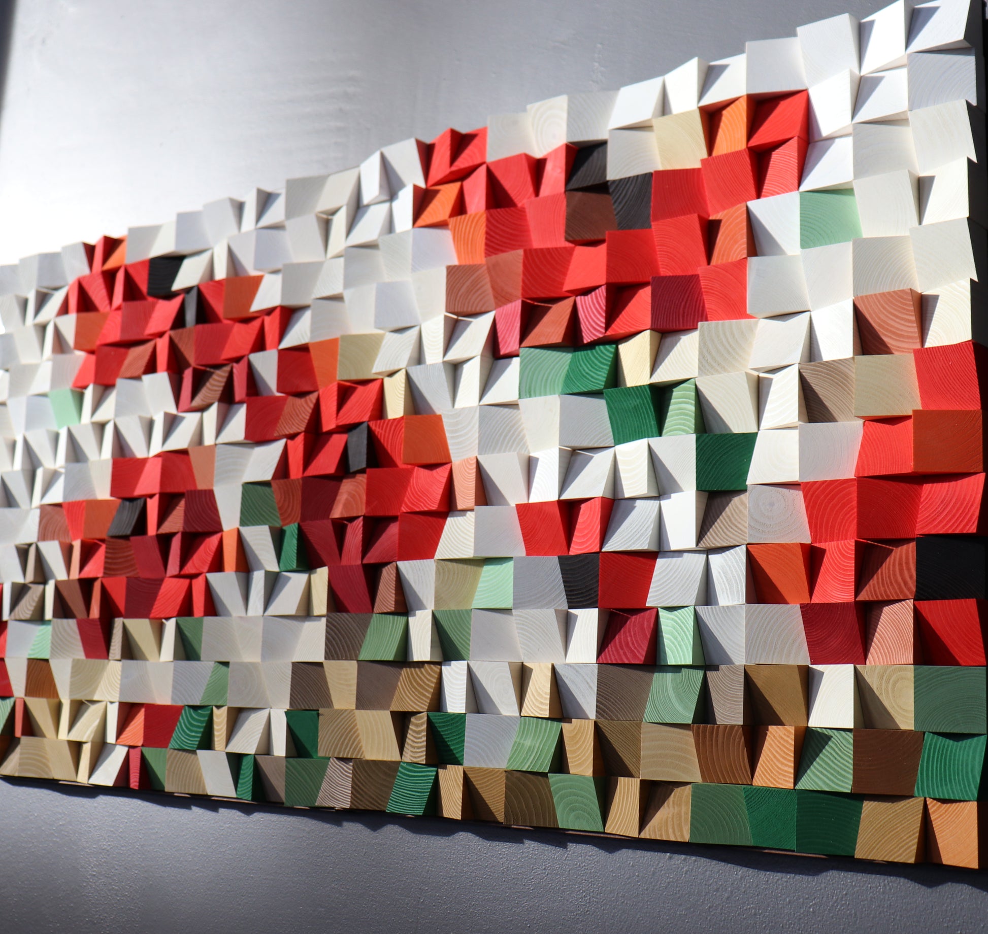 Colorful 3D wooden wall art with bold red, beige, and green accents by WoodenPix.