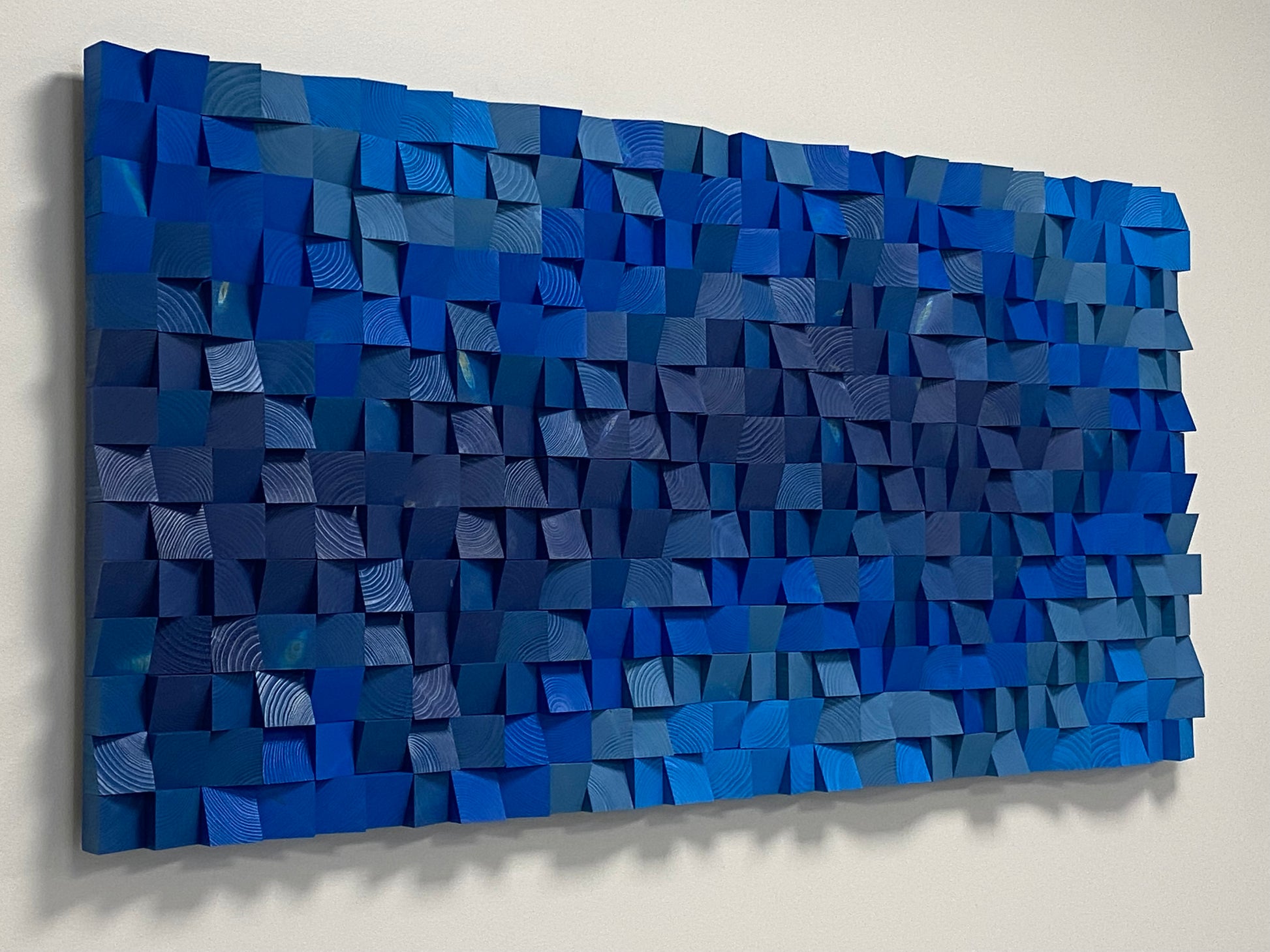 Handcrafted blue wooden wall art highlighting geometric texture and fine wood grain by WoodenPix.