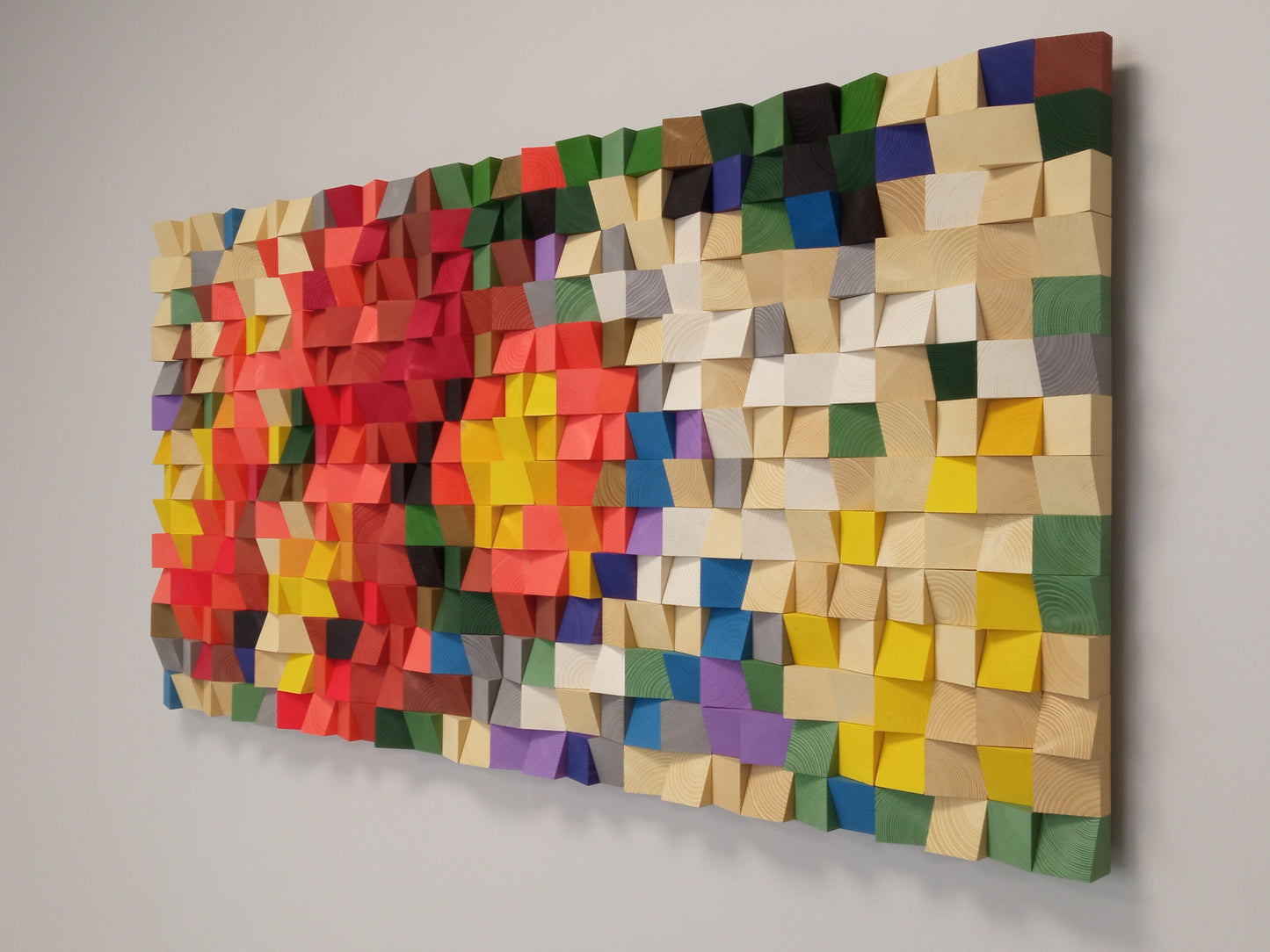WoodenPix handcrafted 3D wall panel with geometric color composition and acoustic properties.