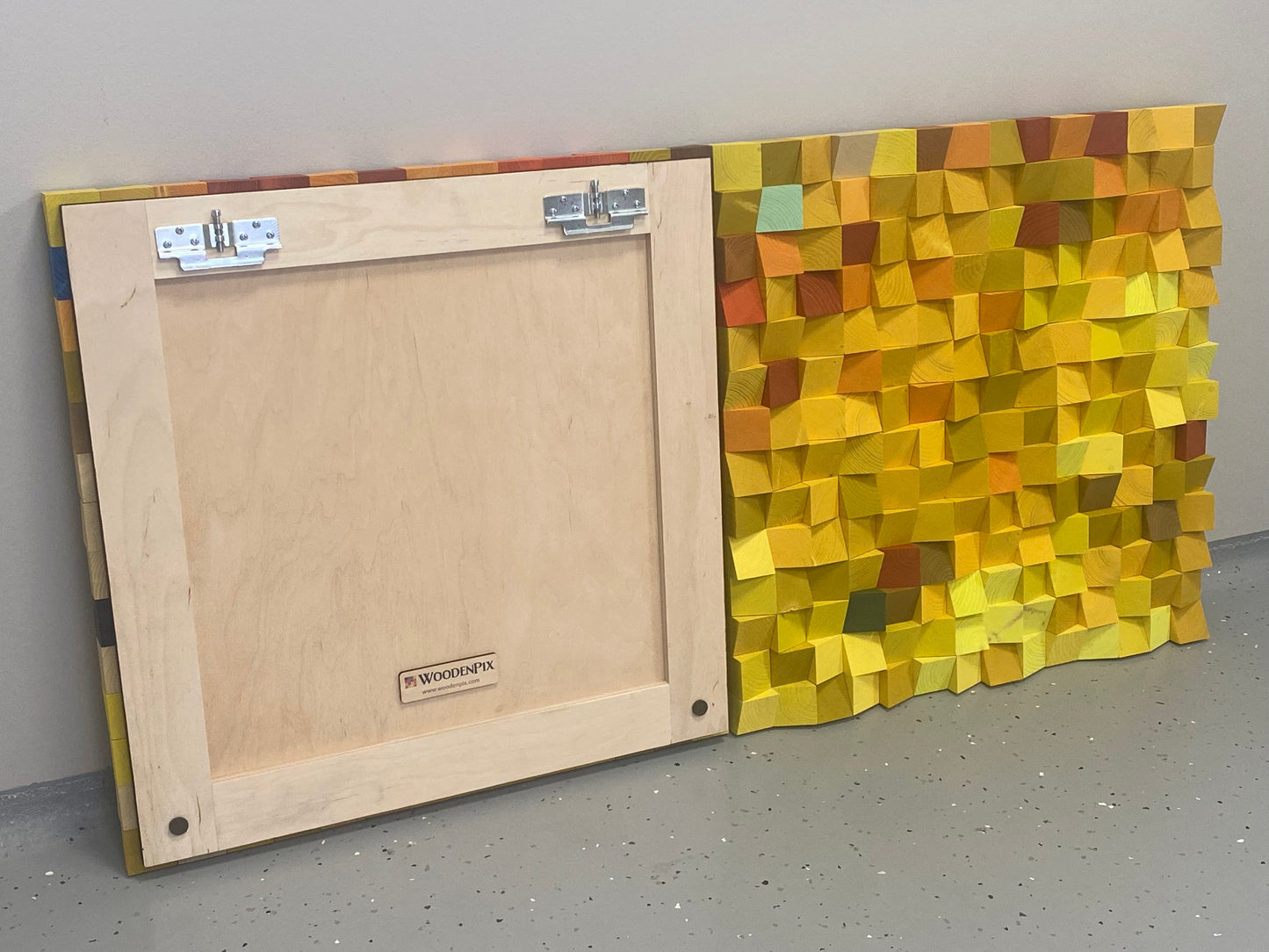 WoodenPix handcrafted 3D acoustic wall panel with geometric wooden cubes inspired by autumn leaves.