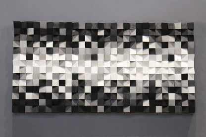Minimalist wooden wall decoration showcasing elegant black and white contrasts with natural wood texture.