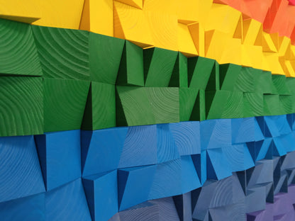 Modern geometric wooden wall panel with rainbow gradient blocks, ideal as an acoustic art piece for home or studio.