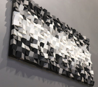 Geometric modern art wood wall piece made from hand-carved blocks in grayscale shades.