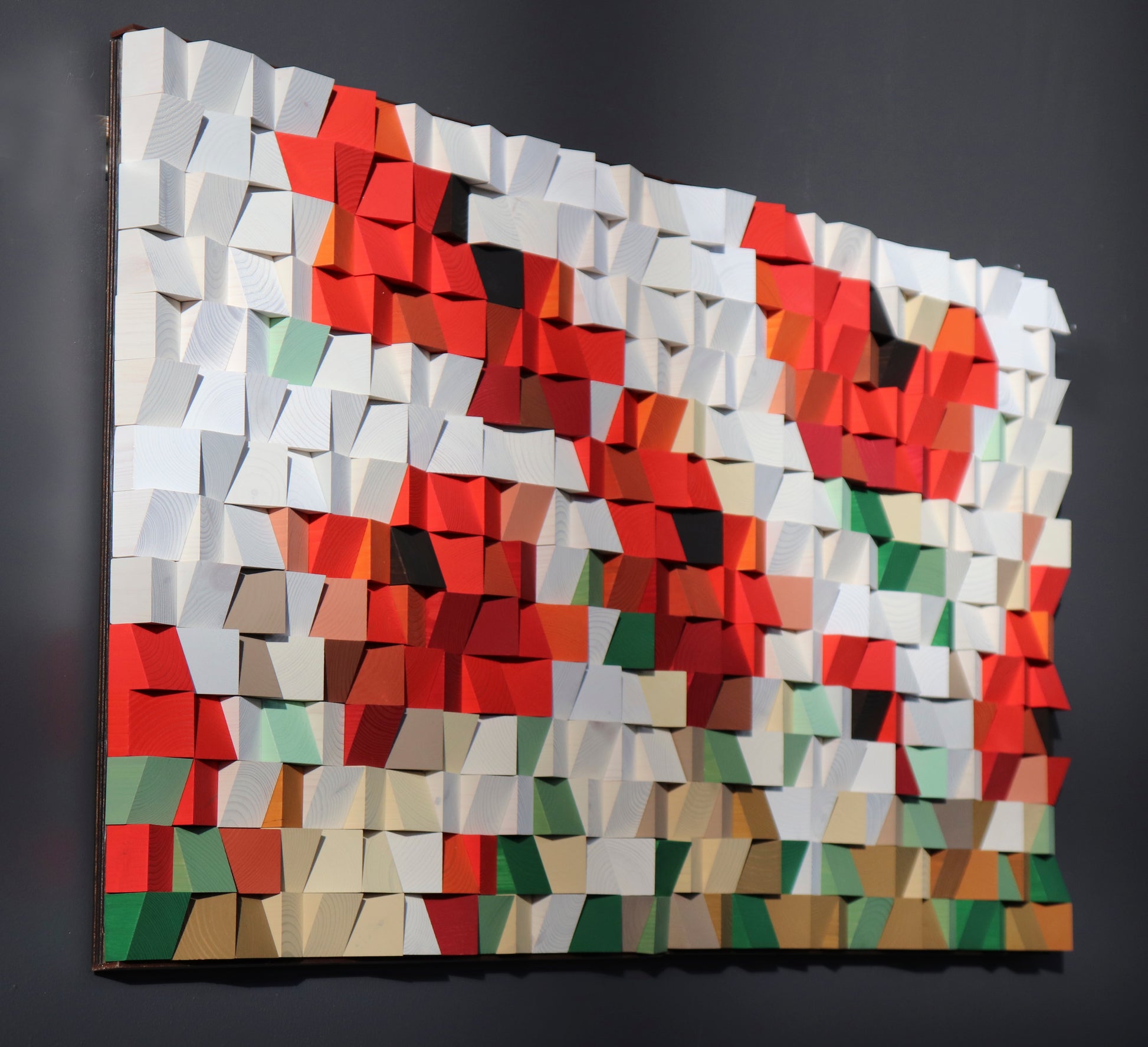 Modern geometric wooden wall decor in red, white, and green tones for contemporary interiors.