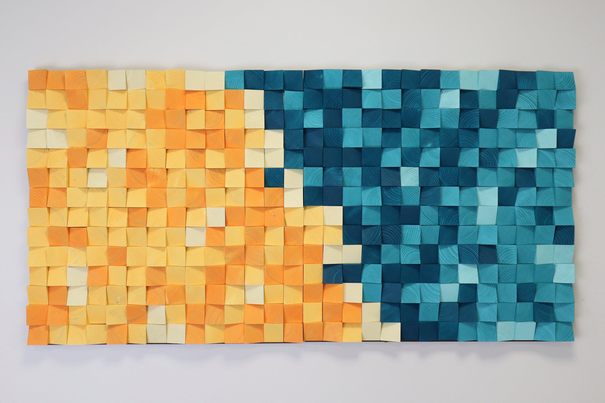 Modern wooden wall art inspired by tropical lagoons, handcrafted from colorful natural wood blocks.