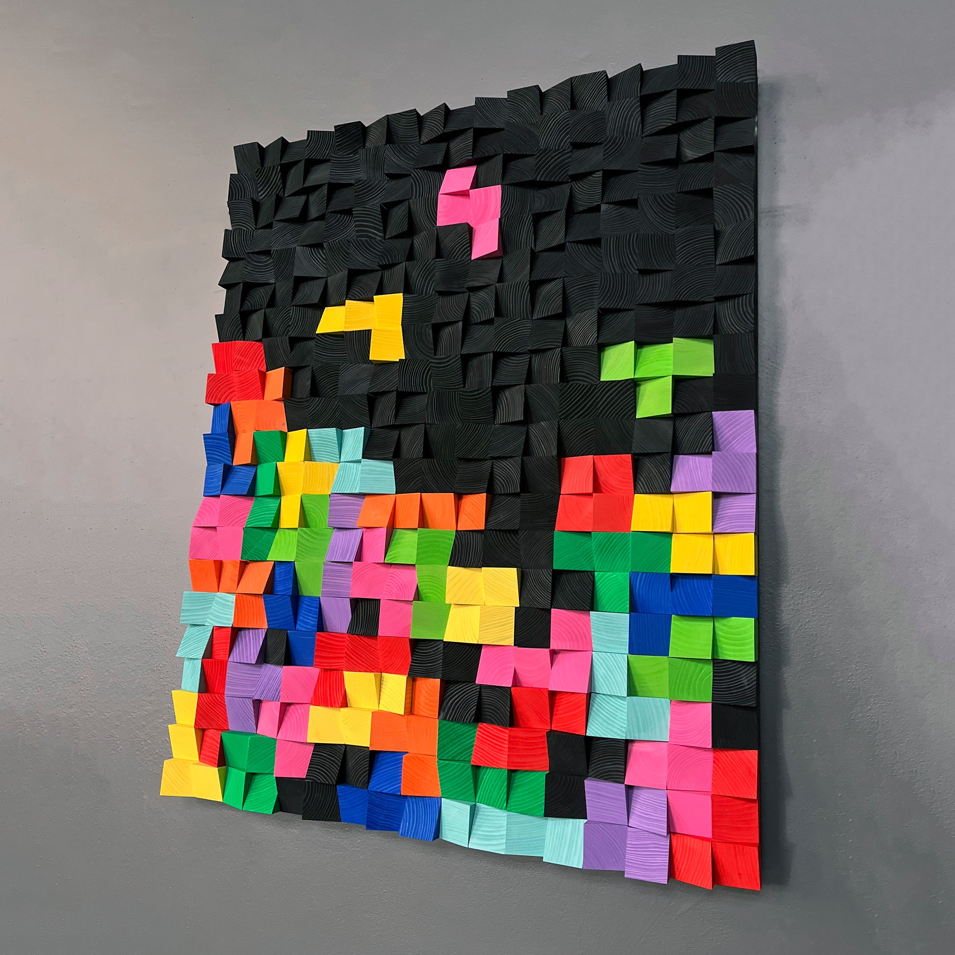 Bold 3D wooden acoustic panel with bright color contrast and textured design.