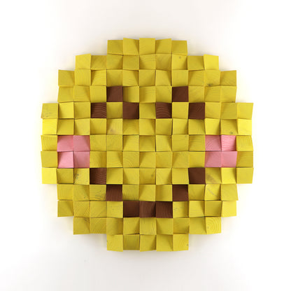 Handmade 3D wooden smiley face emoji wall art created from sculpted yellow wood blocks in a pixel-style design.