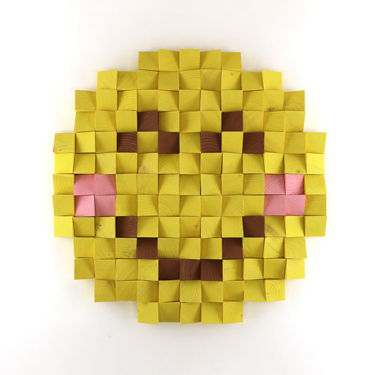 Handmade 3D wooden smiley face emoji wall art created from sculpted yellow wood blocks in a pixel-style design.