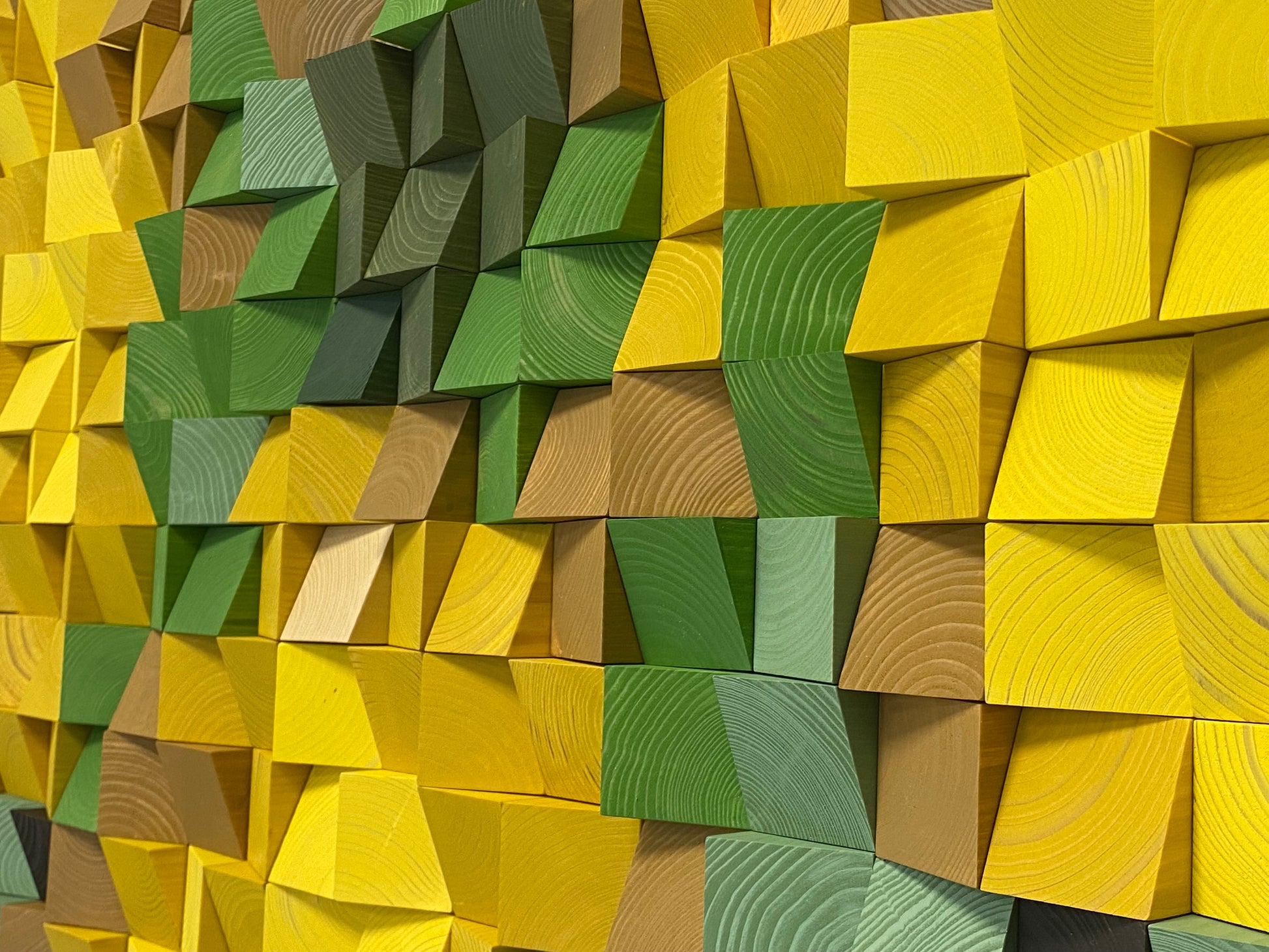 Handcrafted wooden wall art in natural tones designed as an acoustic sound diffuser panel.