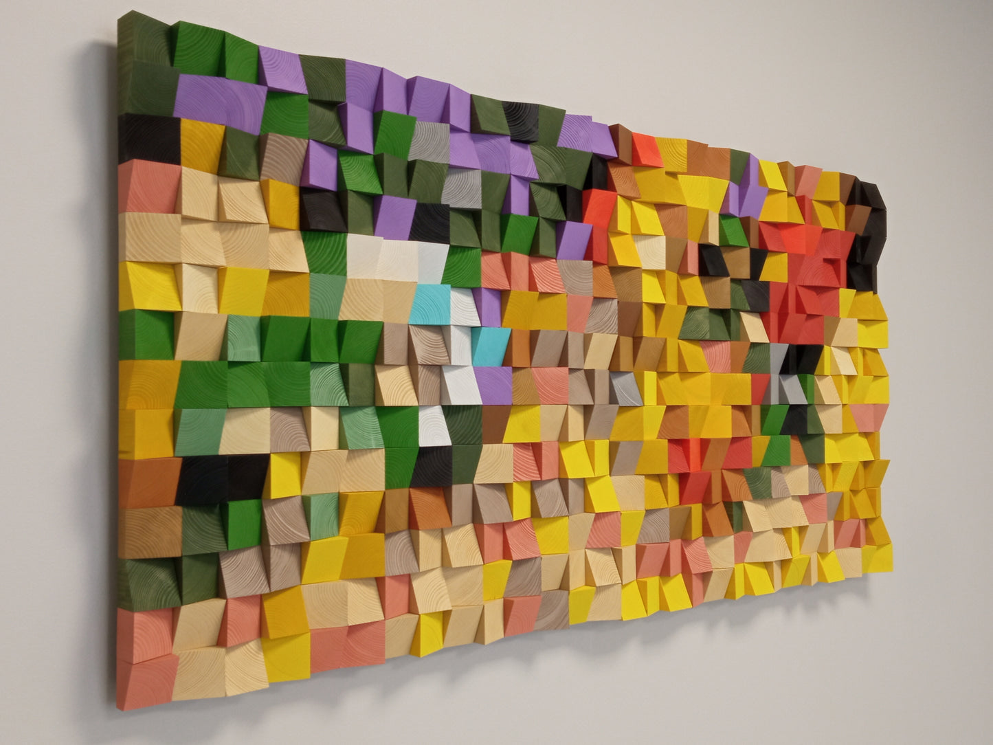 Decorative wooden acoustic panel with geometric blocks inspired by fall landscapes and sound-enhancing design.