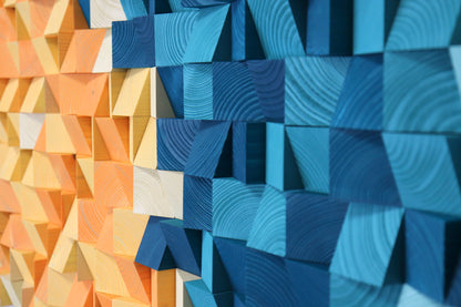 Textured wood wall sculpture featuring bold turquoise and yellow shades with a sun-meets-sea design.