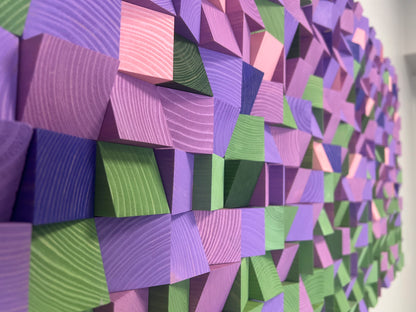 Textured wooden wall sculpture featuring bold lavender and green hues for modern home interiors.