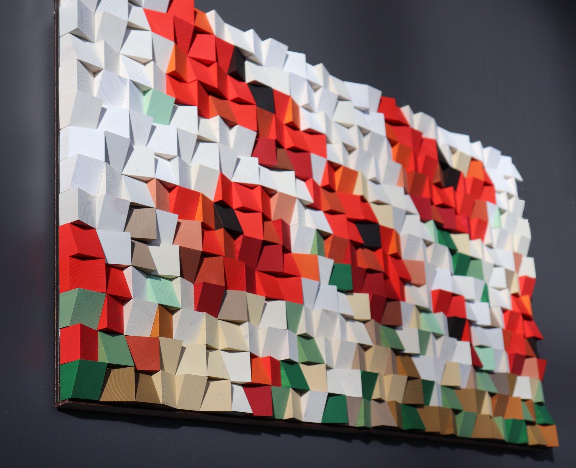 Modern wooden wall panel with geometric depth and vibrant color palette, handcrafted by WoodenPix.