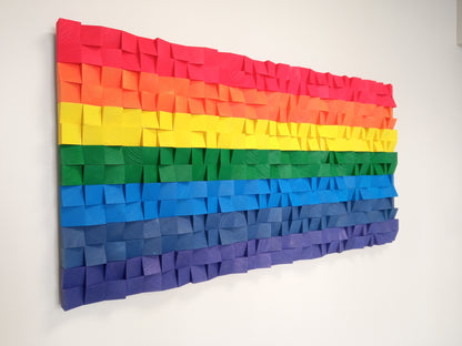 Wooden sound diffuser wall art with colorful layers enhancing both acoustics and visual design.