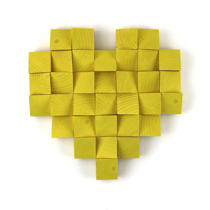 Decorative yellow wooden heart wall art created for contemporary living spaces